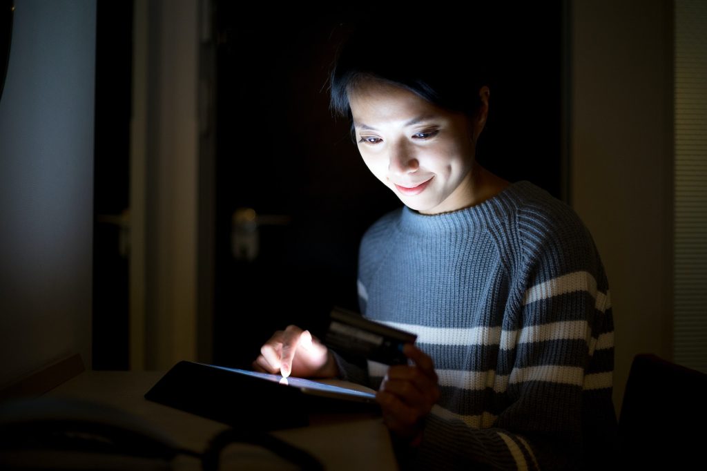 Woman using tablet for online shopping