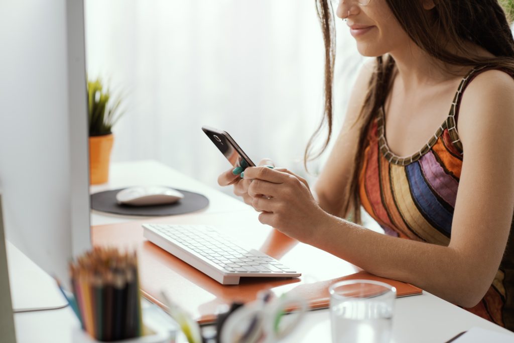 Woman typing on a keyboard