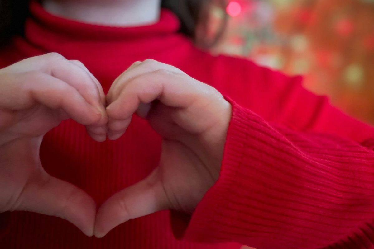 Loving charitable hearts at Christmas background